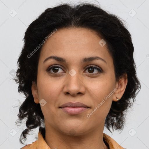 Joyful latino adult female with medium  brown hair and brown eyes