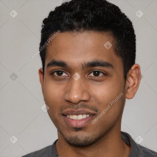 Joyful latino young-adult male with short  black hair and brown eyes