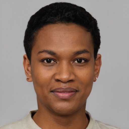 Joyful black young-adult female with short  black hair and brown eyes