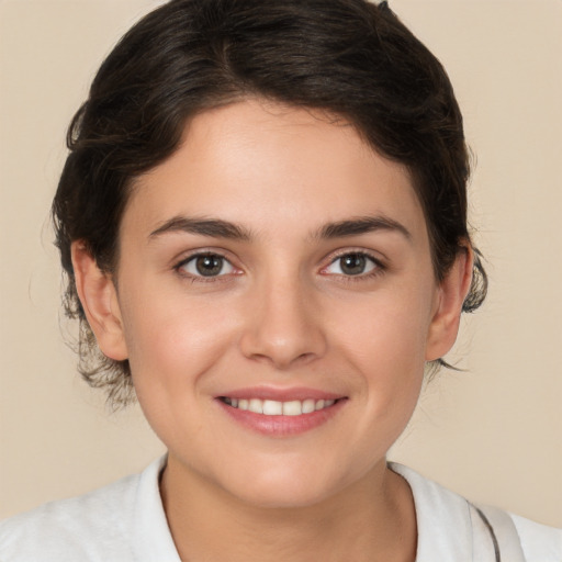 Joyful white young-adult female with medium  brown hair and brown eyes