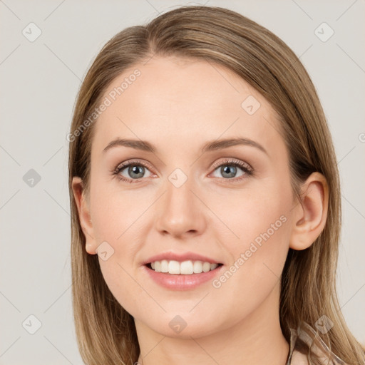 Joyful white young-adult female with long  brown hair and grey eyes