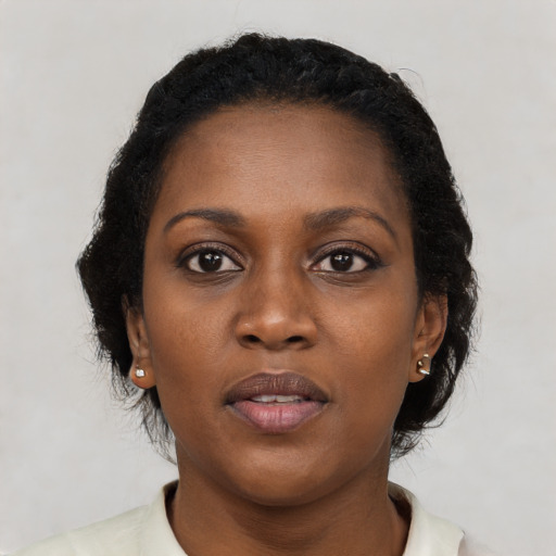 Neutral black young-adult female with short  black hair and brown eyes