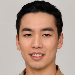 Joyful asian young-adult male with short  black hair and brown eyes