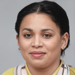 Joyful latino young-adult female with short  brown hair and brown eyes