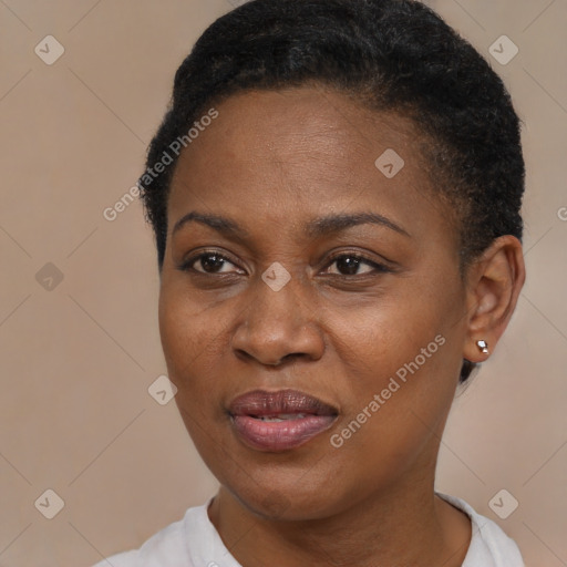 Joyful black young-adult female with short  brown hair and brown eyes