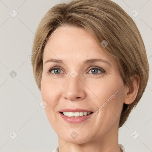 Joyful white young-adult female with medium  brown hair and green eyes