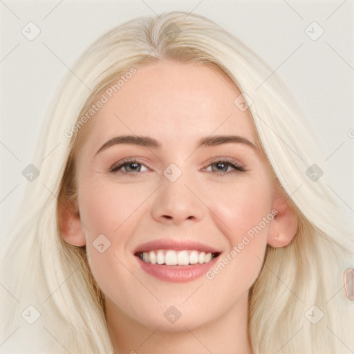 Joyful white young-adult female with long  brown hair and blue eyes