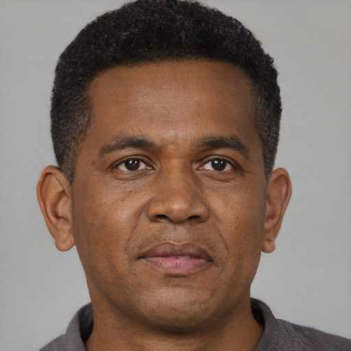 Neutral black young-adult male with short  brown hair and brown eyes