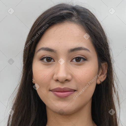 Joyful latino young-adult female with long  brown hair and brown eyes