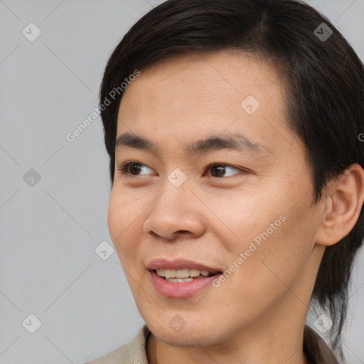 Joyful asian young-adult male with short  brown hair and brown eyes