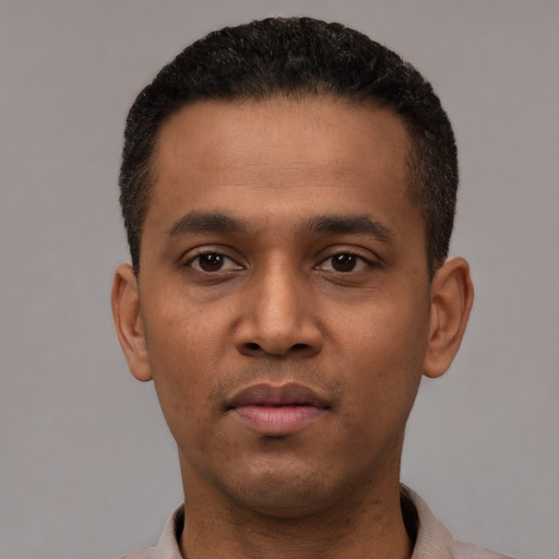 Neutral latino young-adult male with short  black hair and brown eyes