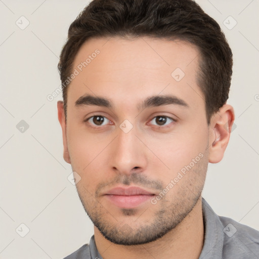 Neutral white young-adult male with short  brown hair and brown eyes