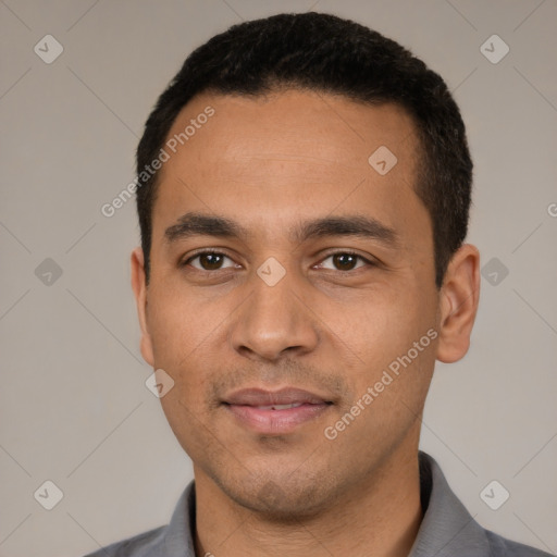 Joyful white young-adult male with short  black hair and brown eyes