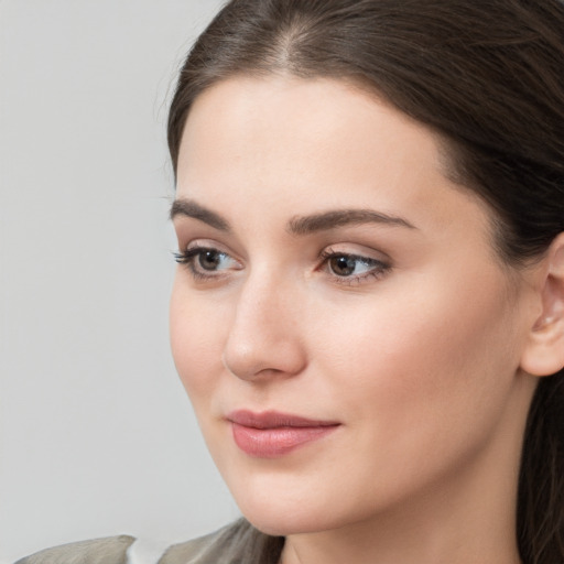 Neutral white young-adult female with medium  brown hair and brown eyes