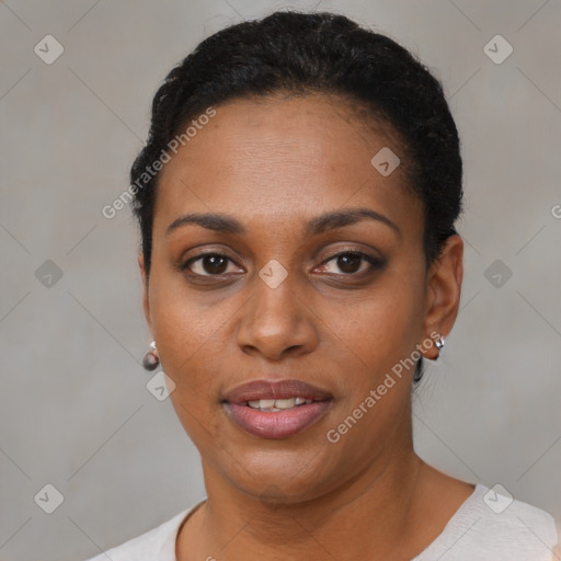 Joyful black young-adult female with short  black hair and brown eyes