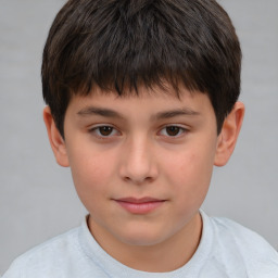 Joyful white child male with short  brown hair and brown eyes