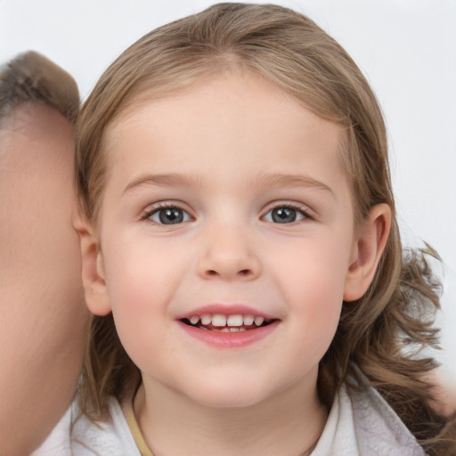 Joyful white child female with medium  brown hair and blue eyes