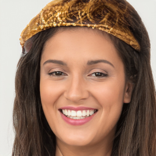 Joyful white young-adult female with long  brown hair and brown eyes