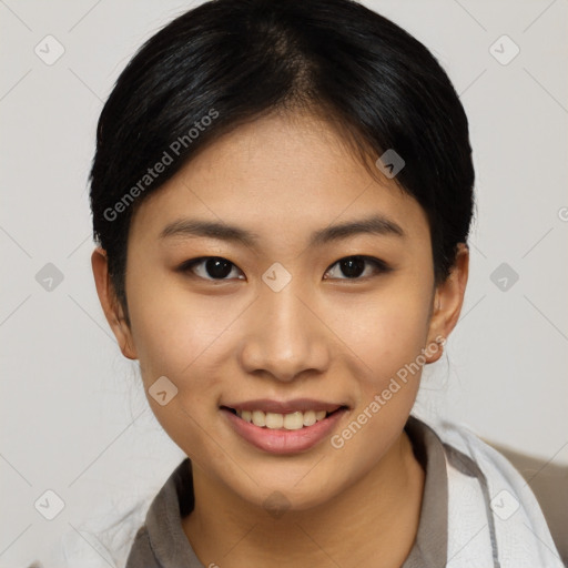 Joyful asian young-adult female with short  brown hair and brown eyes