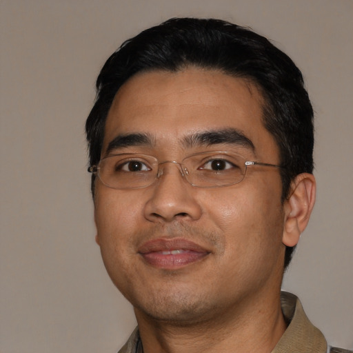 Joyful asian young-adult male with short  black hair and brown eyes