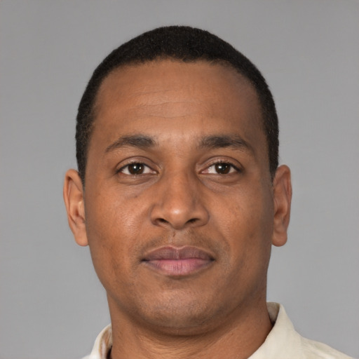 Neutral latino adult male with short  brown hair and brown eyes