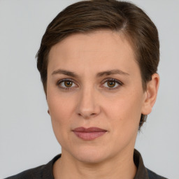 Joyful white adult female with short  brown hair and brown eyes