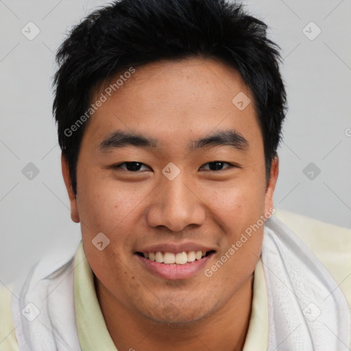 Joyful asian young-adult male with short  black hair and brown eyes