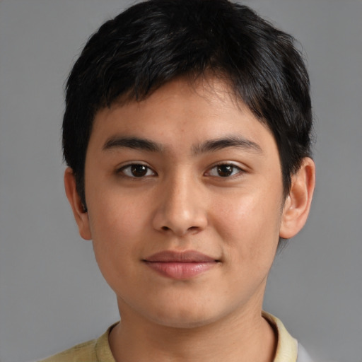 Joyful latino young-adult male with short  brown hair and brown eyes