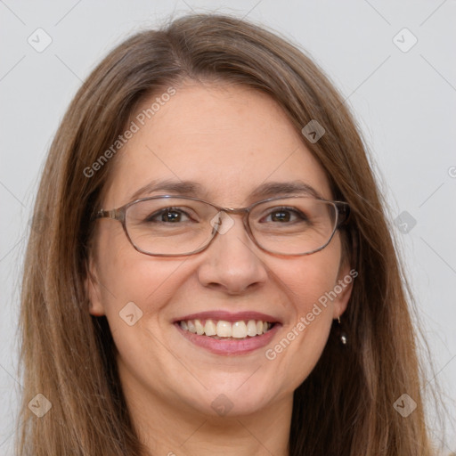 Joyful white adult female with long  brown hair and grey eyes