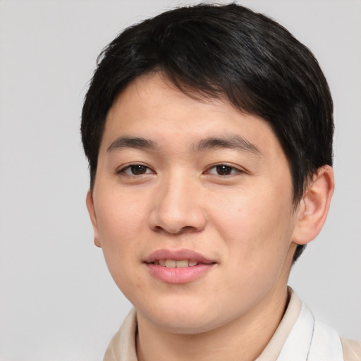 Joyful asian young-adult male with short  brown hair and brown eyes