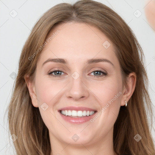 Joyful white young-adult female with long  brown hair and blue eyes