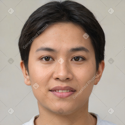 Joyful asian young-adult female with short  brown hair and brown eyes