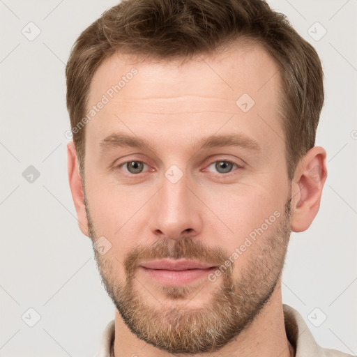 Neutral white young-adult male with short  brown hair and grey eyes