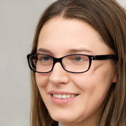 Joyful white young-adult female with long  brown hair and blue eyes