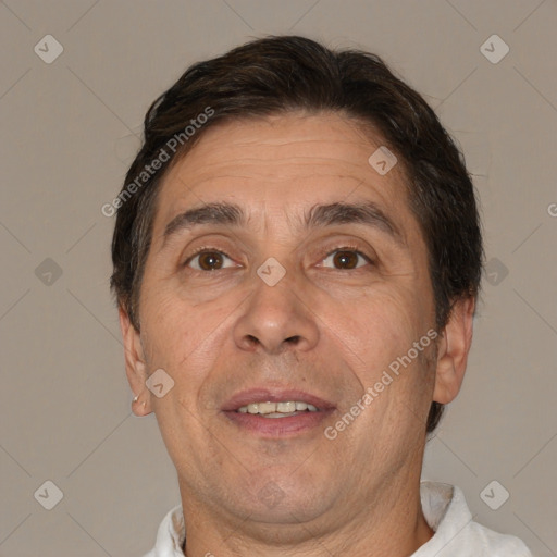 Joyful white adult male with short  brown hair and brown eyes