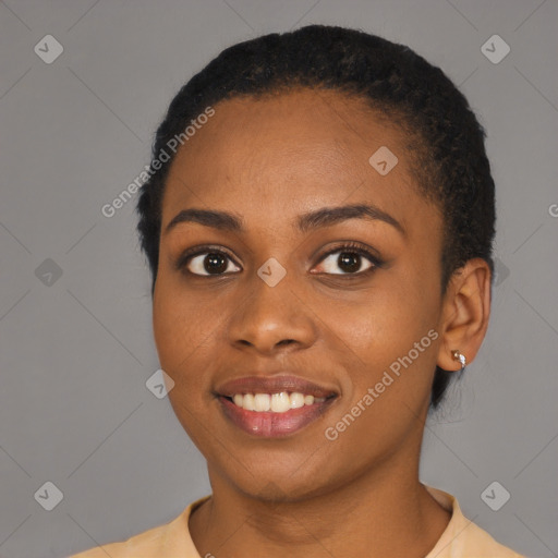 Joyful latino young-adult female with short  black hair and brown eyes