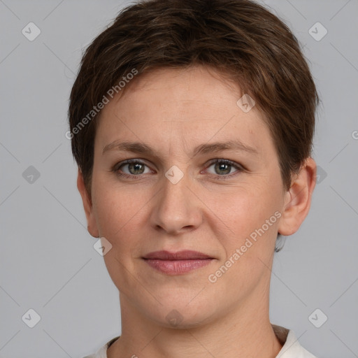 Joyful white young-adult female with short  brown hair and grey eyes