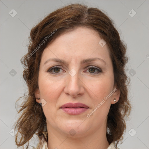 Joyful white adult female with medium  brown hair and grey eyes