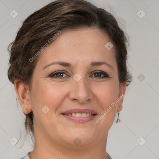 Joyful white adult female with short  brown hair and brown eyes