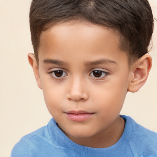 Joyful white child male with short  brown hair and brown eyes