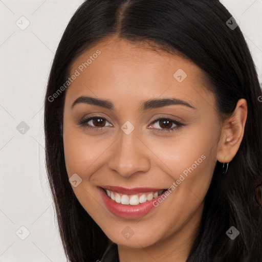 Joyful latino young-adult female with long  brown hair and brown eyes