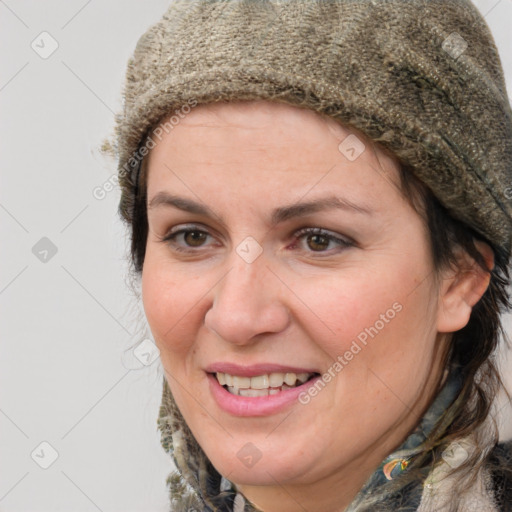 Joyful white adult female with short  brown hair and brown eyes