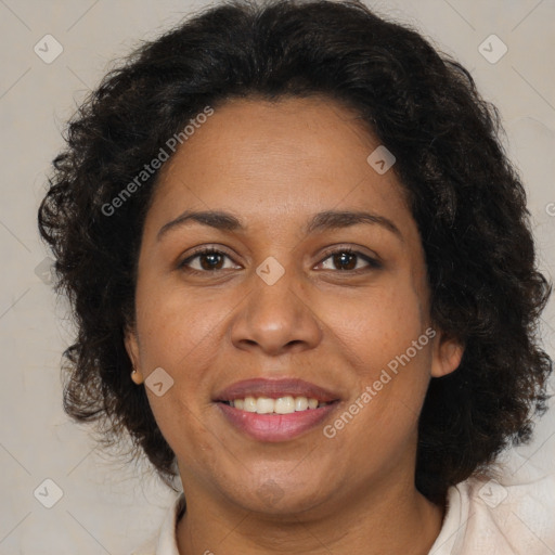 Joyful black adult female with medium  brown hair and brown eyes