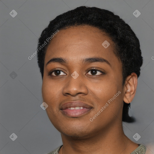 Joyful black young-adult female with short  black hair and brown eyes