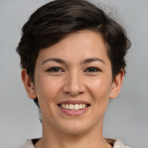 Joyful white young-adult female with short  brown hair and brown eyes