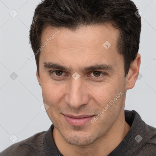 Joyful white adult male with short  brown hair and brown eyes