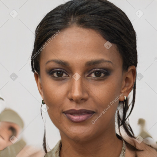 Joyful black young-adult female with medium  brown hair and brown eyes