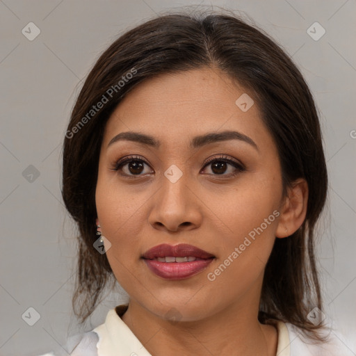 Joyful asian young-adult female with medium  brown hair and brown eyes
