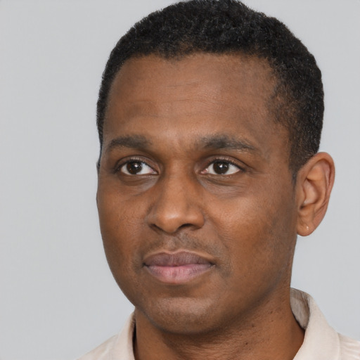 Neutral black adult male with short  black hair and brown eyes