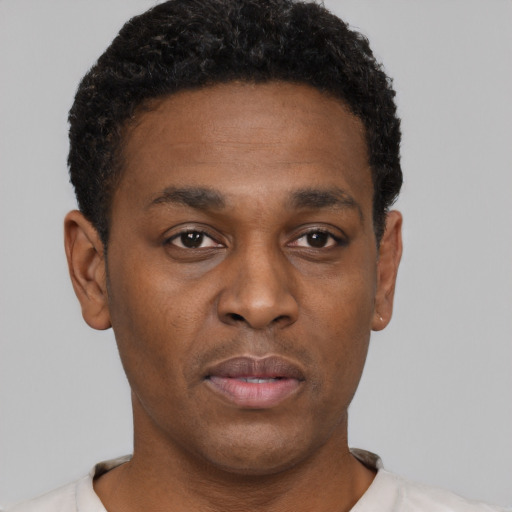 Neutral black young-adult male with short  black hair and brown eyes